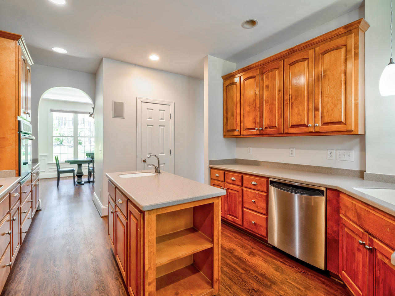 Wood cabinetry and an island in a kitchen