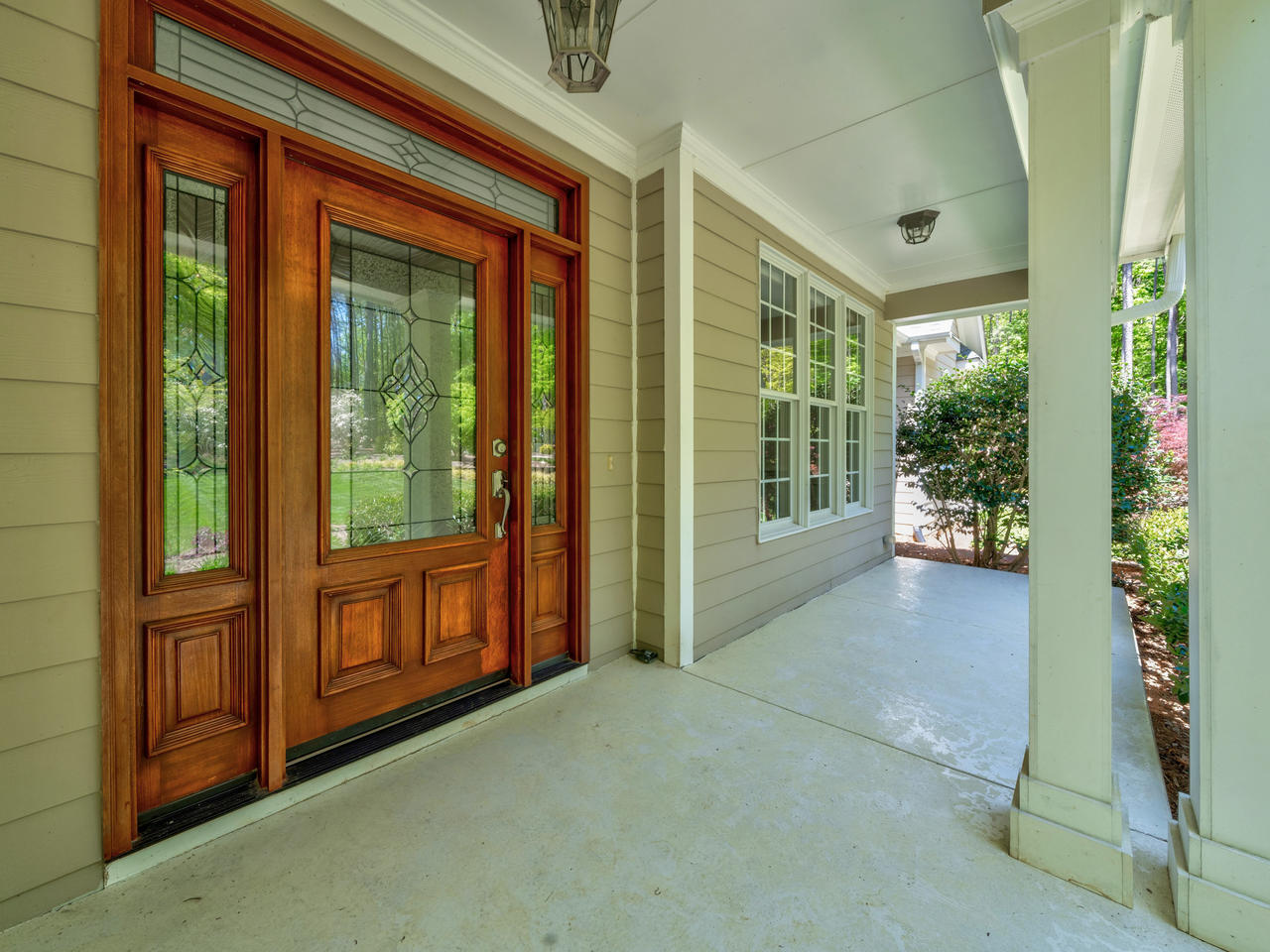 Wood front door and covered porch
